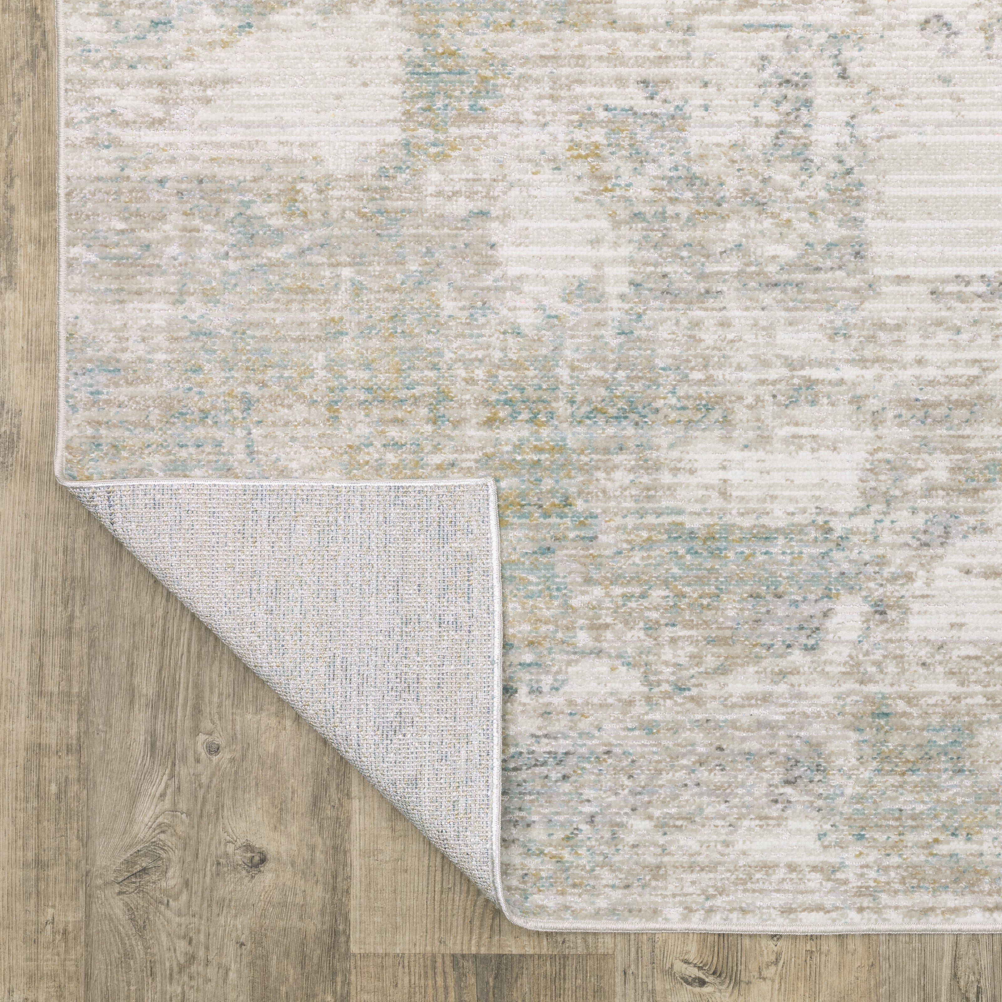 Oriental Weavers Cavett CAV01 soft transitional rug featuring decorative pattern in ivory/ teal tones