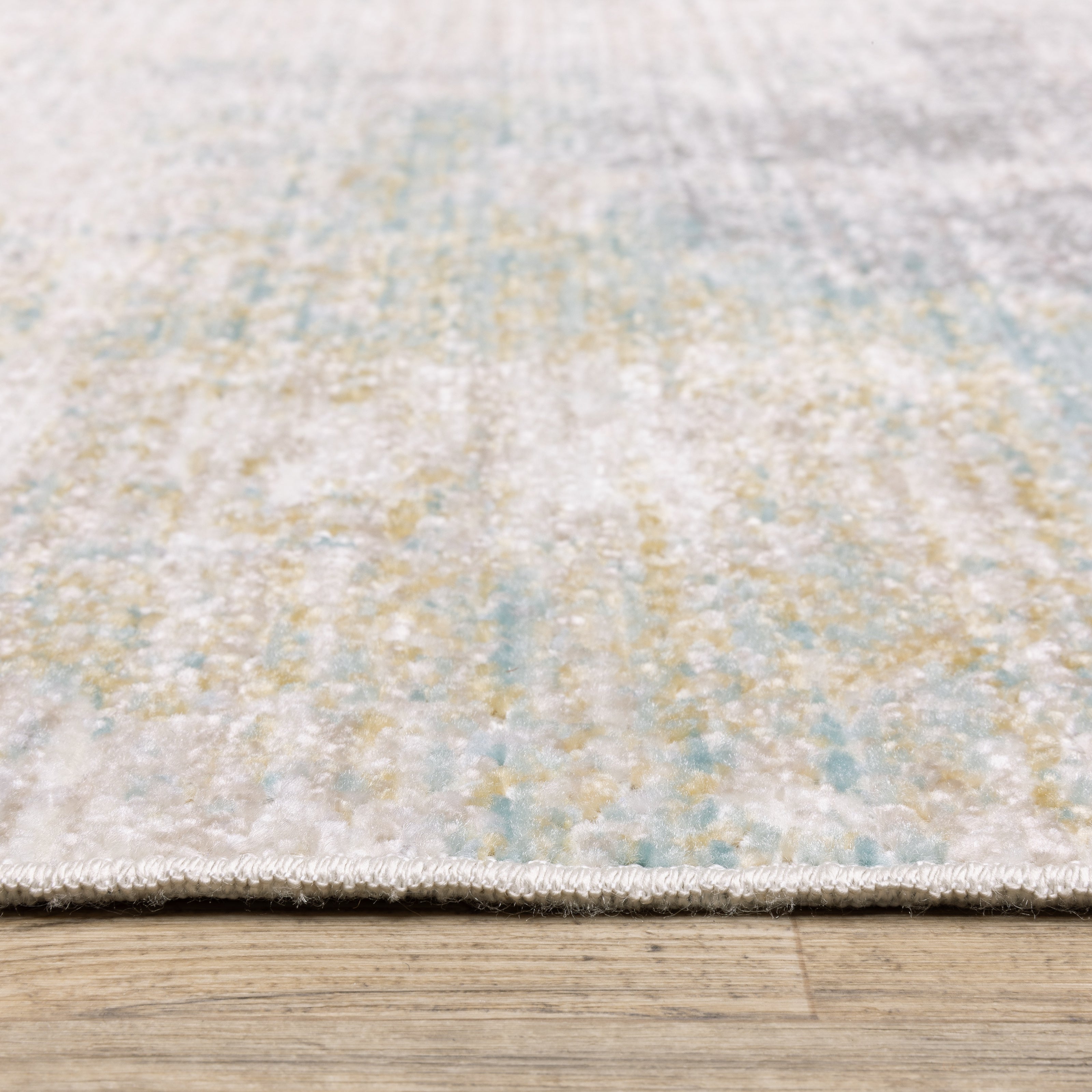 Oriental Weavers Cavett CAV01 soft transitional rug featuring decorative pattern in ivory/ teal tones
