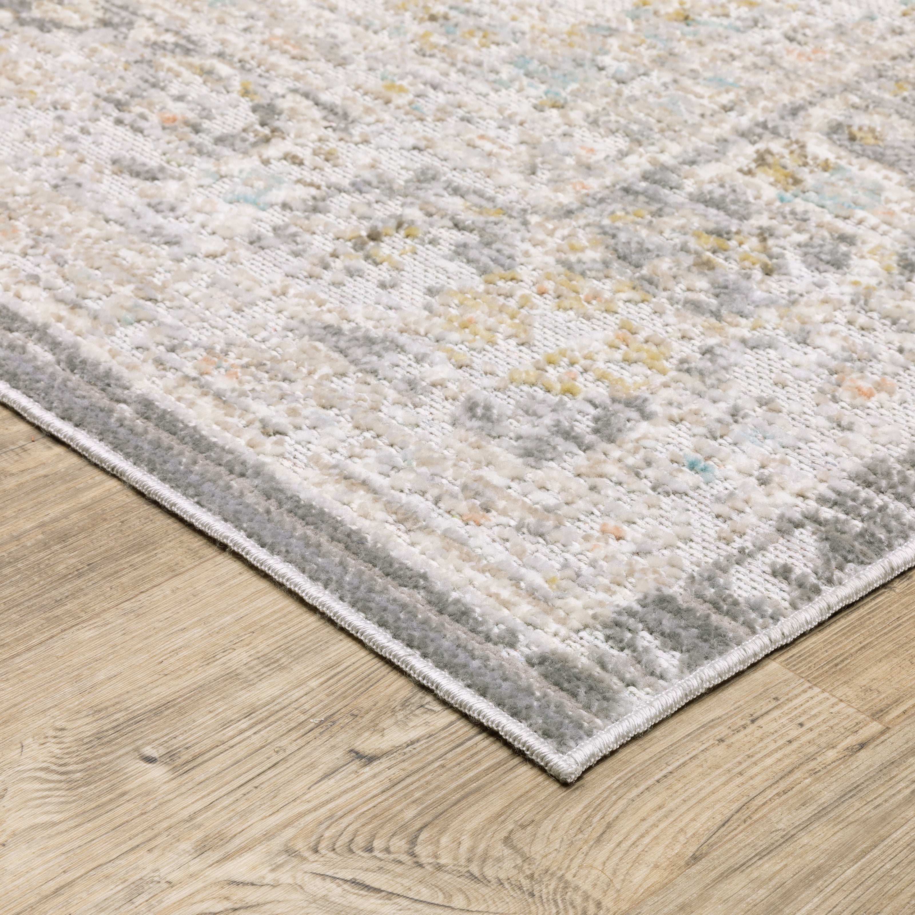 Oriental Weavers Cavett CAV02 soft transitional rug featuring decorative pattern in grey/ orange tones