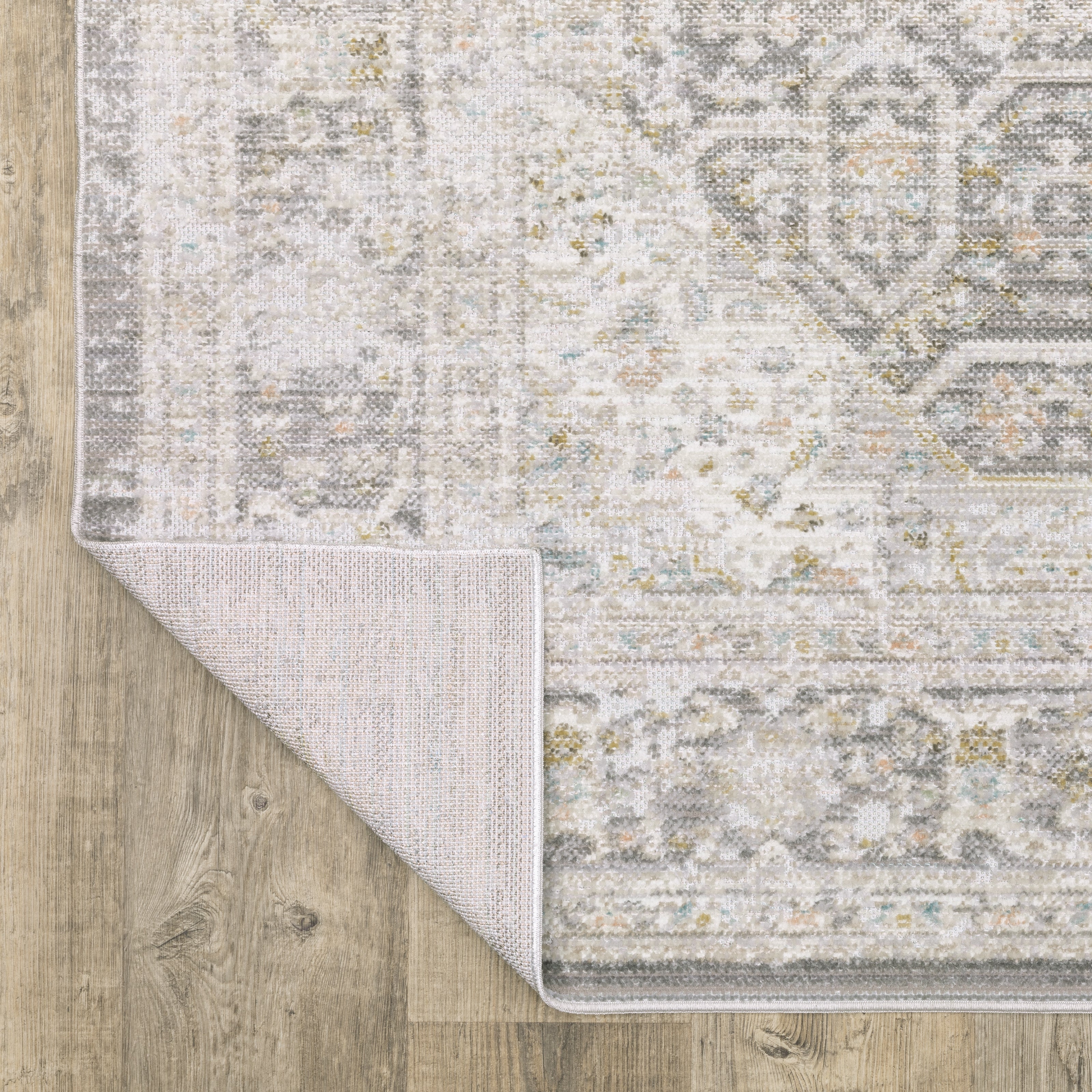 Oriental Weavers Cavett CAV02 soft transitional rug featuring decorative pattern in grey/ orange tones