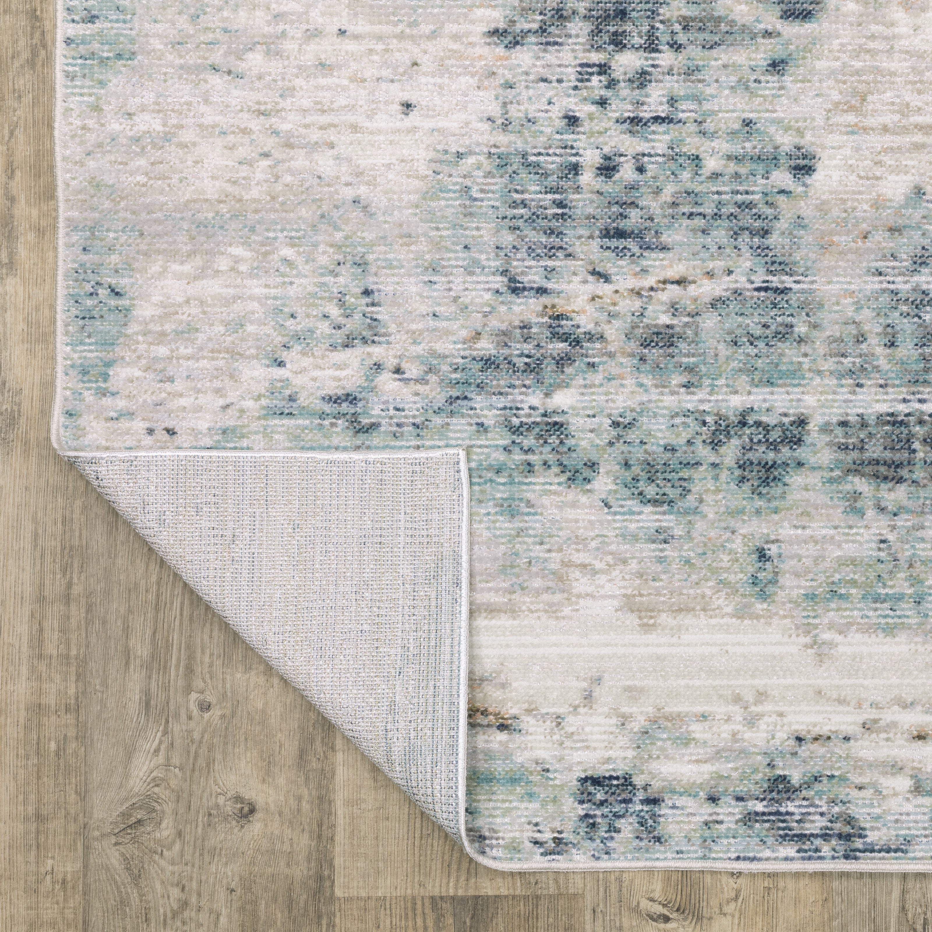 Oriental Weavers Cavett CAV03 soft transitional rug featuring decorative pattern in ivory/ blue tones