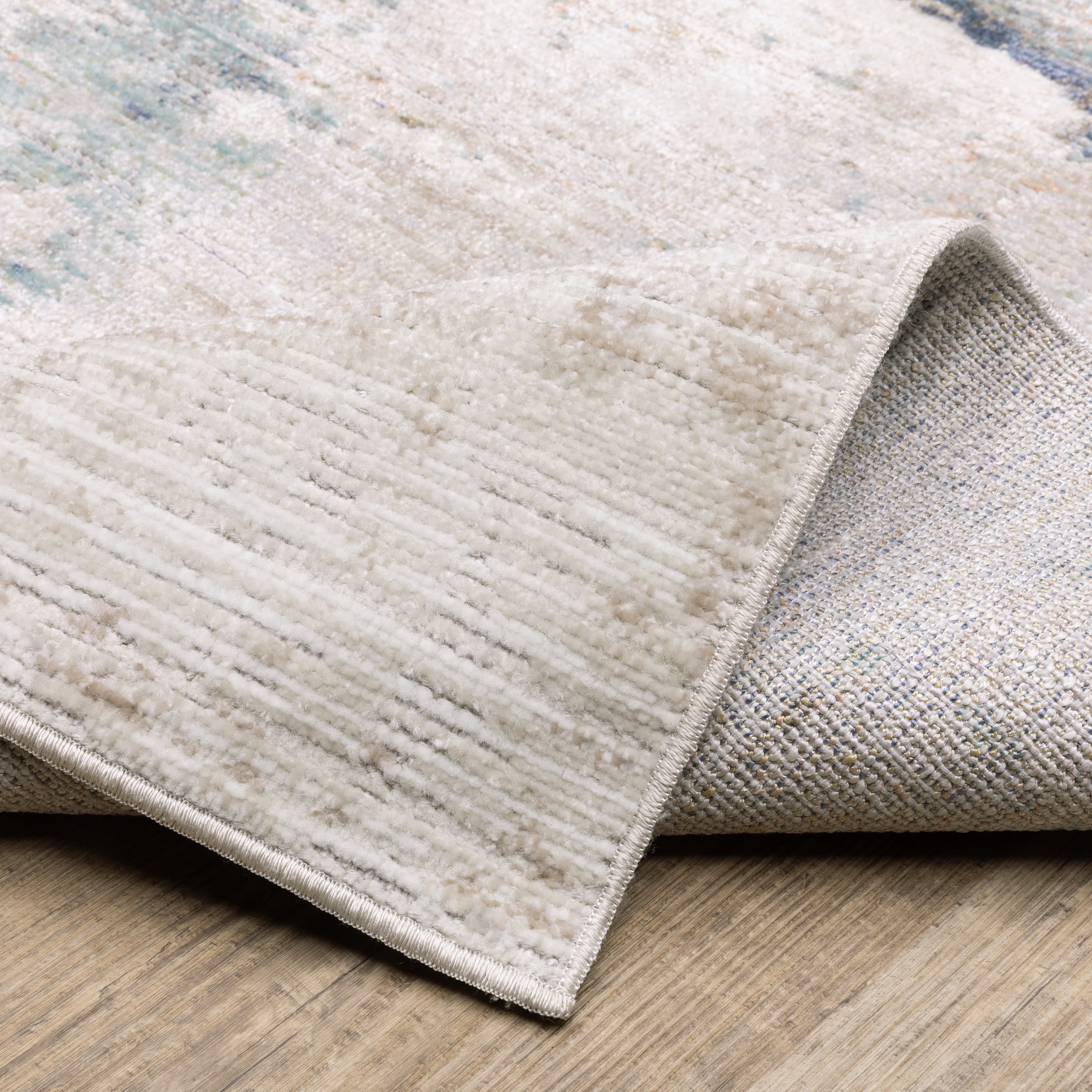 Oriental Weavers Cavett CAV03 soft transitional rug featuring decorative pattern in ivory/ blue tones
