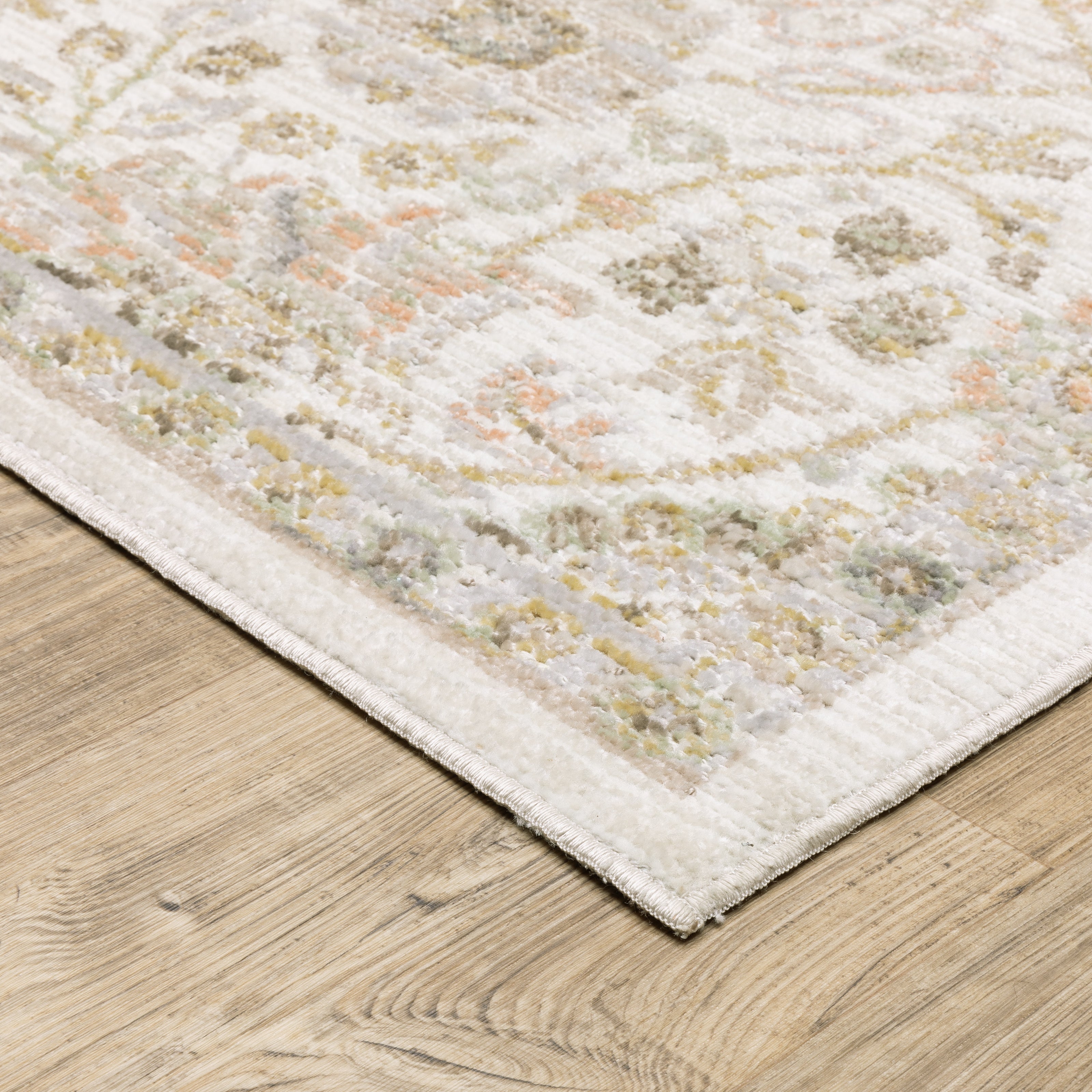 Oriental Weavers Cavett CAV05 soft transitional rug featuring decorative pattern in ivory/ gold tones