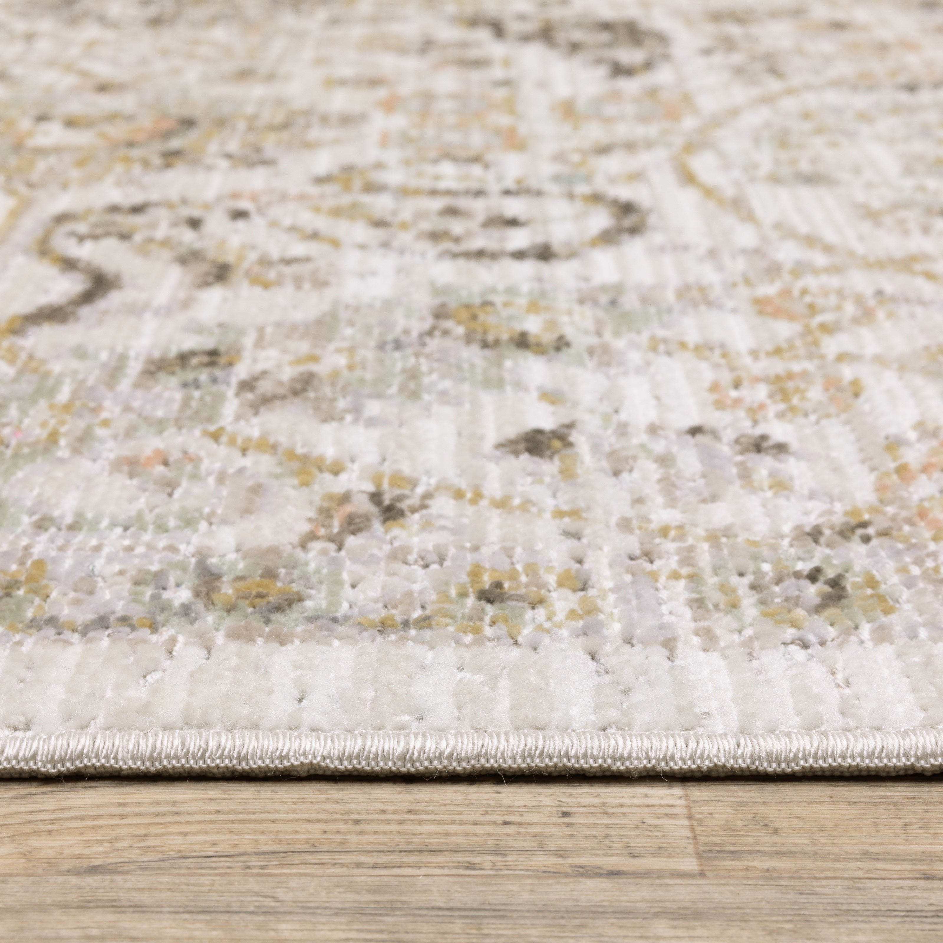 Oriental Weavers Cavett CAV05 soft transitional rug featuring decorative pattern in ivory/ gold tones