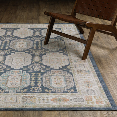 Oriental Weavers Cavett CAV07 soft transitional rug featuring decorative pattern in navy/ ivory tones