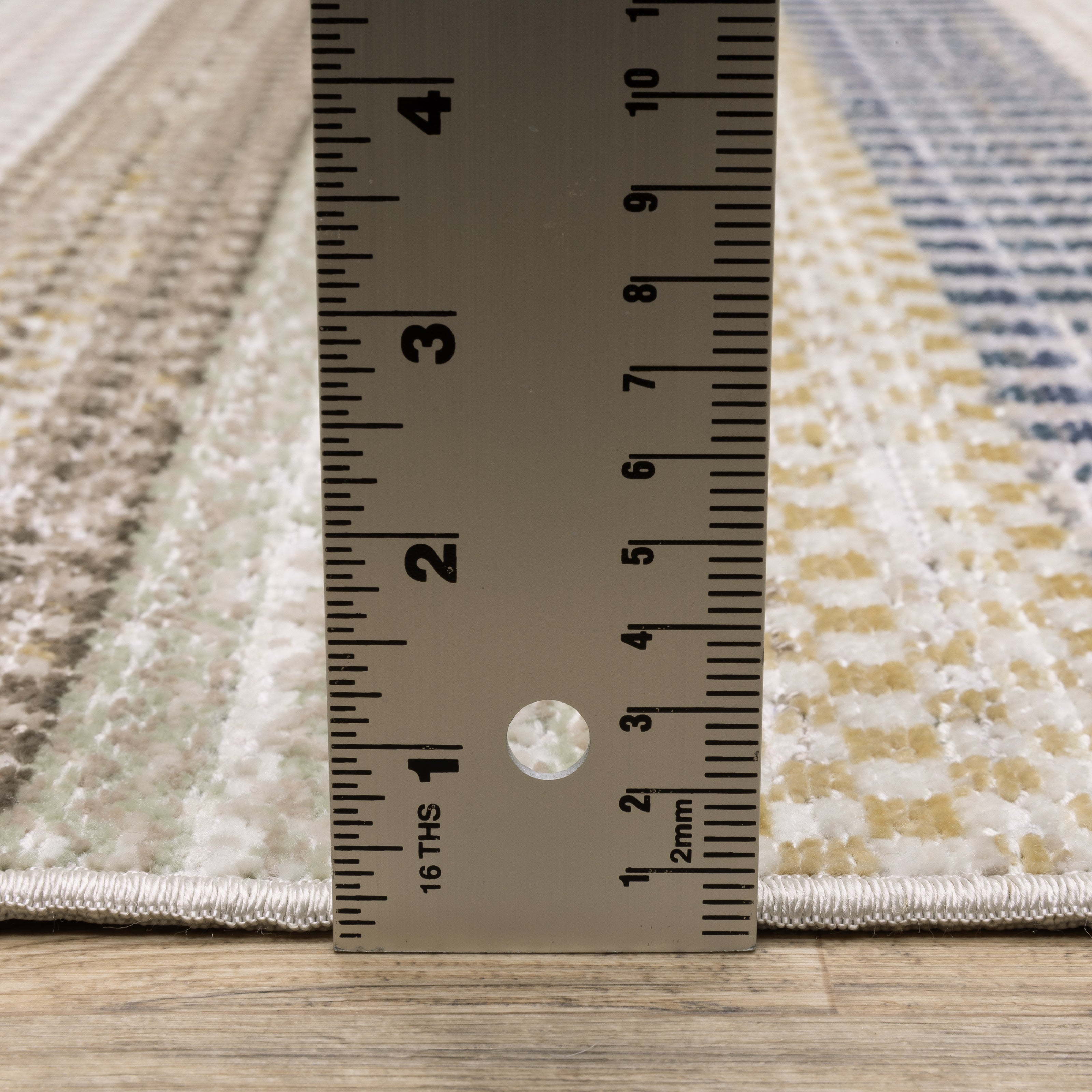 Oriental Weavers Cavett CAV08 soft transitional rug featuring decorative pattern in ivory/ multi tones