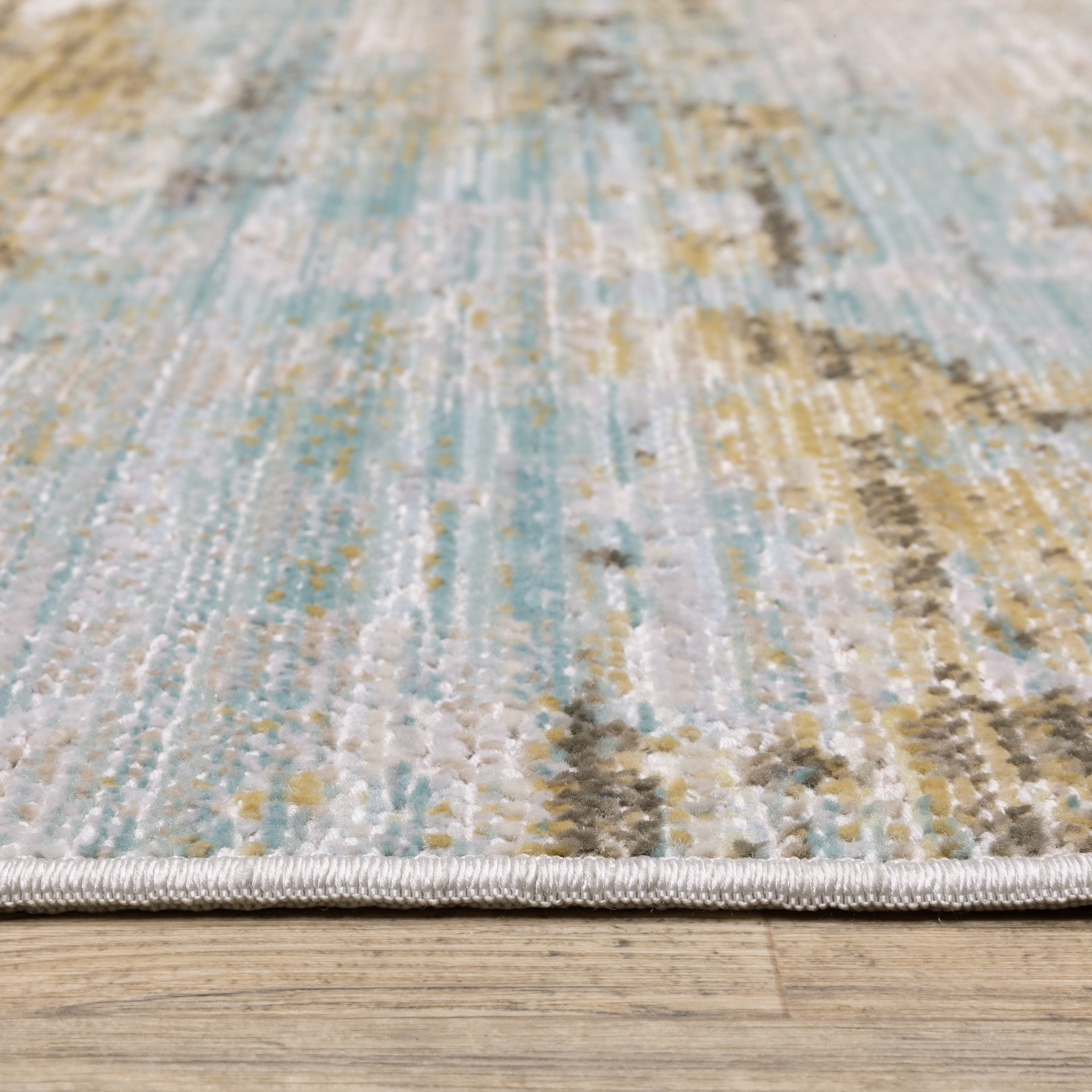 Oriental Weavers Cavett CAV09 soft transitional rug featuring decorative pattern in blue/ beige tones