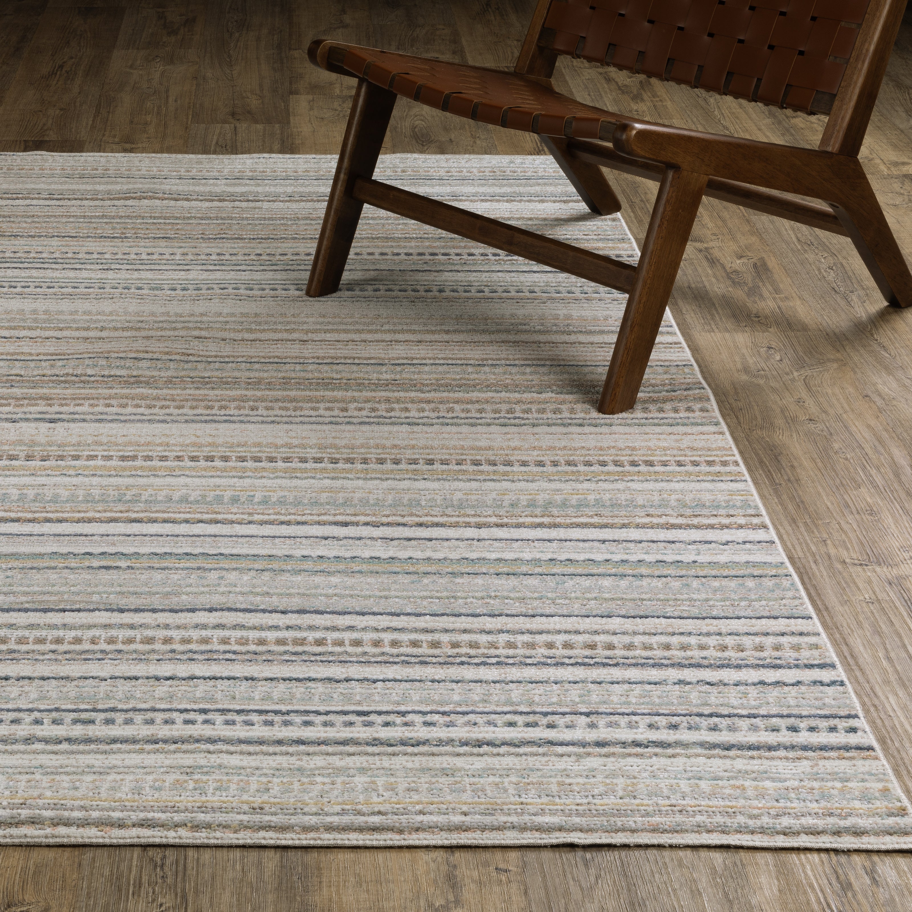 Oriental Weavers Cavett CAV10 soft transitional rug featuring decorative pattern in beige/ multi tones