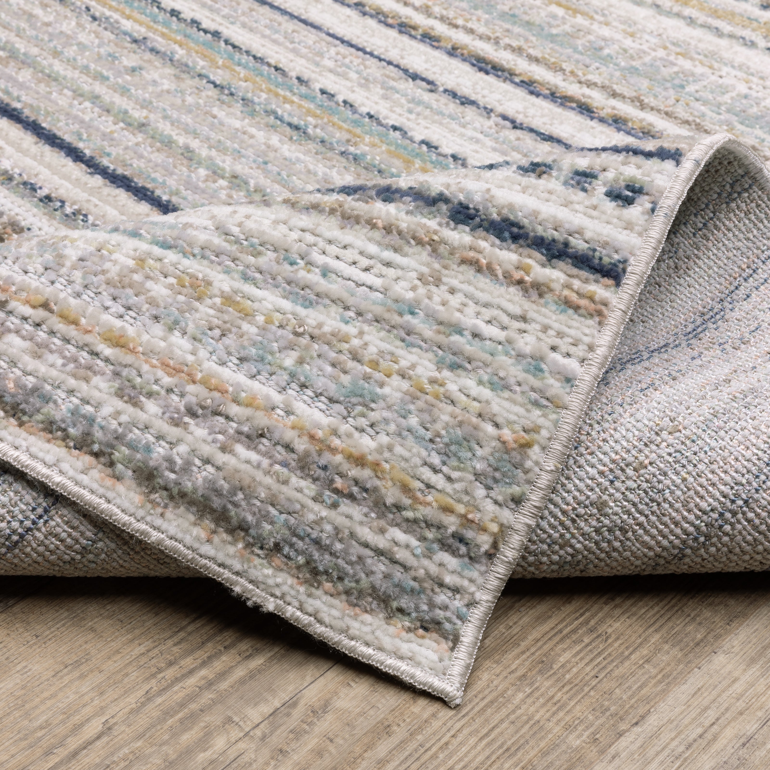 Oriental Weavers Cavett CAV10 soft transitional rug featuring decorative pattern in beige/ multi tones