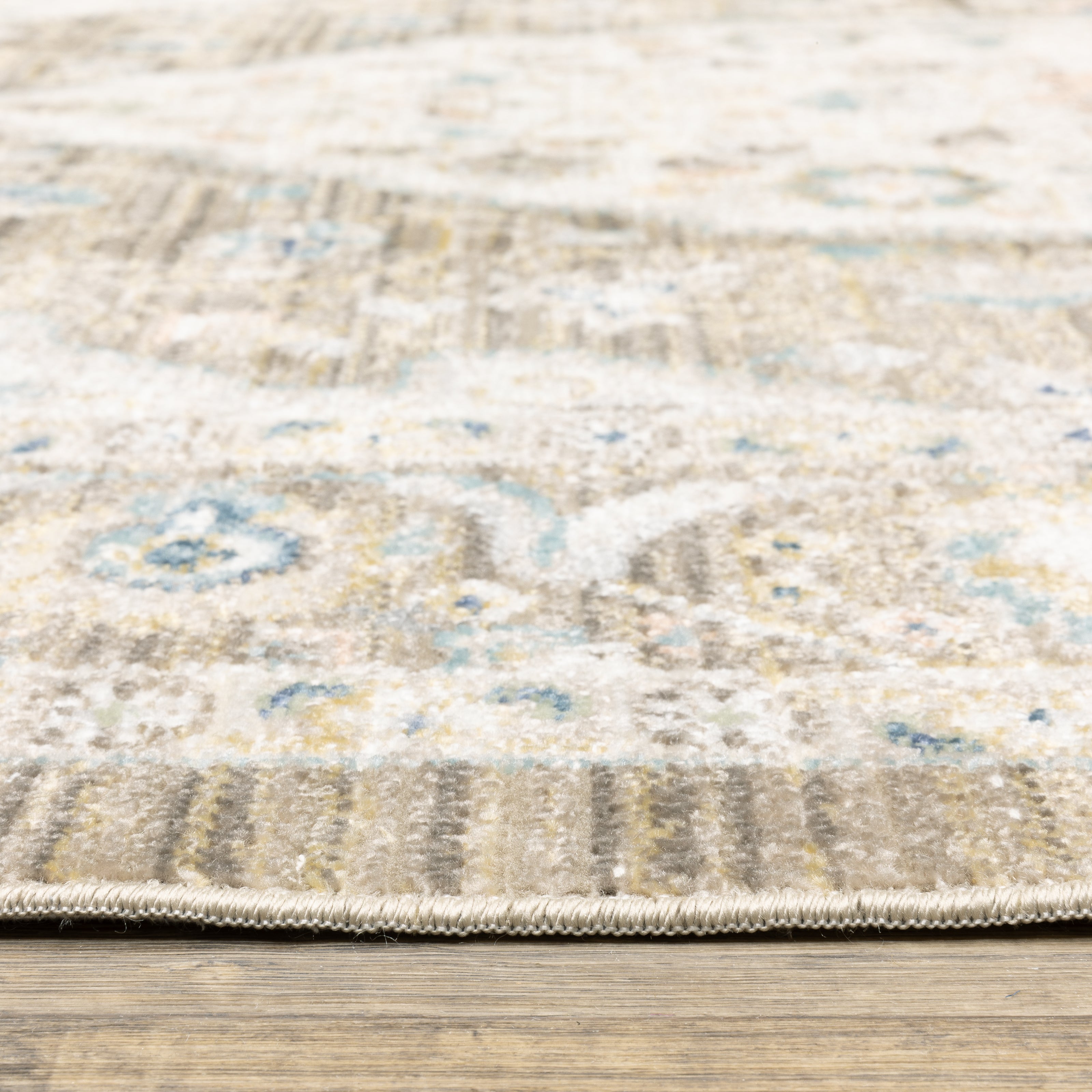 Oriental Weavers Cavett CAV12 soft transitional rug featuring decorative pattern in brown/ blue tones