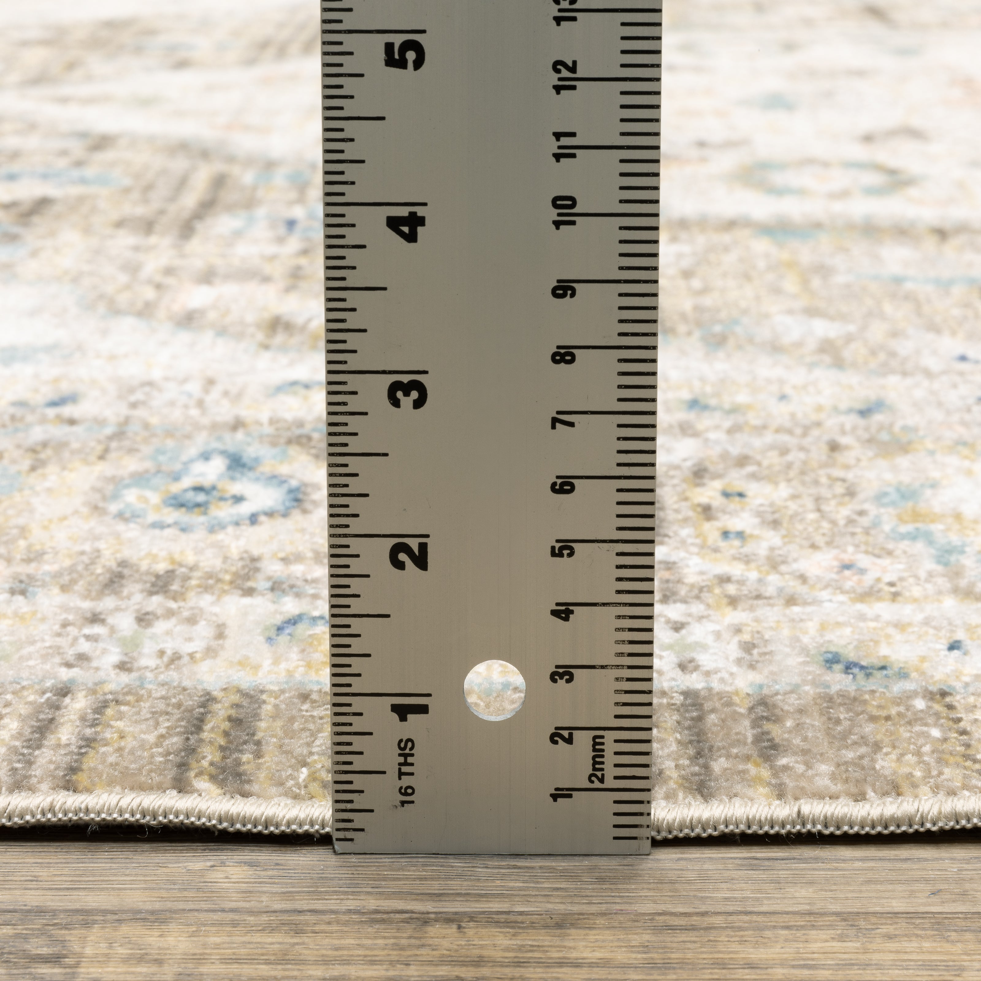 Oriental Weavers Cavett CAV12 soft transitional rug featuring decorative pattern in brown/ blue tones