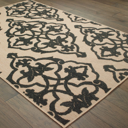 Oriental Weavers Cayman 001B9 textured indoor-outdoor rug featuring abstract pattern in sand/ charcoal tones