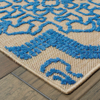 Oriental Weavers Cayman 2541M textured indoor-outdoor rug featuring abstract pattern in sand/ blue tones