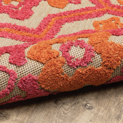 Oriental Weavers Cayman 2541V textured indoor-outdoor rug featuring abstract pattern in sand/ pink tones