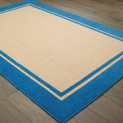 Oriental Weavers Cayman 5594B textured indoor-outdoor rug featuring abstract pattern in sand/ blue tones