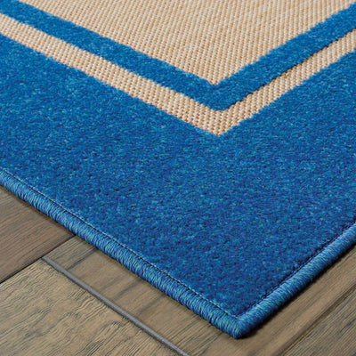 Oriental Weavers Cayman 5594B textured indoor-outdoor rug featuring abstract pattern in sand/ blue tones