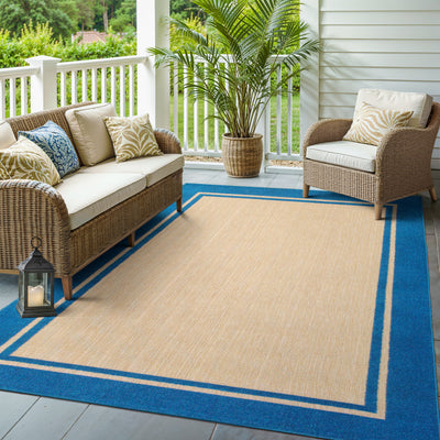 Oriental Weavers Cayman 5594B textured indoor-outdoor rug featuring abstract pattern in sand/ blue tones