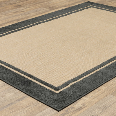 Oriental Weavers Cayman 5594K textured indoor-outdoor rug featuring abstract pattern in sand/ charcoal tones