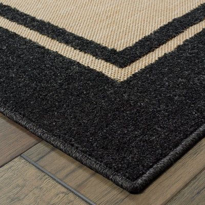Oriental Weavers Cayman 5594K textured indoor-outdoor rug featuring abstract pattern in sand/ charcoal tones