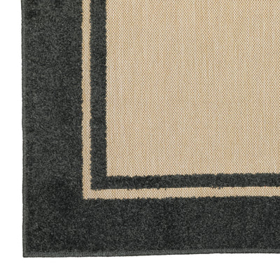 Oriental Weavers Cayman 5594K textured indoor-outdoor rug featuring abstract pattern in sand/ charcoal tones
