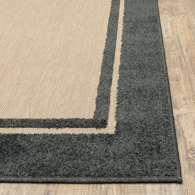 Oriental Weavers Cayman 5594K textured indoor-outdoor rug featuring abstract pattern in sand/ charcoal tones