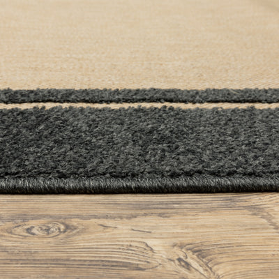 Oriental Weavers Cayman 5594K textured indoor-outdoor rug featuring abstract pattern in sand/ charcoal tones