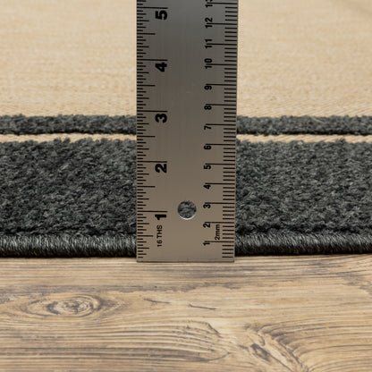 Oriental Weavers Cayman 5594K textured indoor-outdoor rug featuring abstract pattern in sand/ charcoal tones