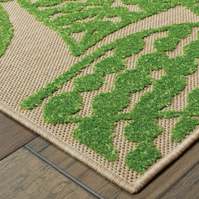 Oriental Weavers Cayman 566F9 textured indoor-outdoor rug featuring abstract pattern in sand/ green tones