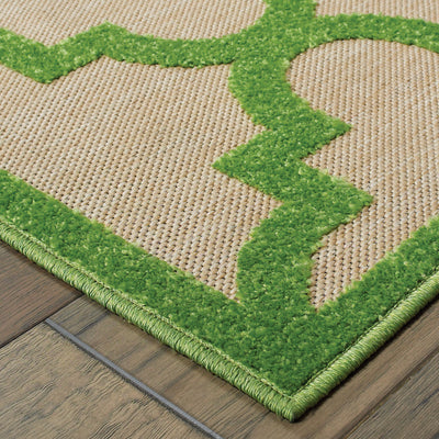 Oriental Weavers Cayman 660F9 textured indoor-outdoor rug featuring abstract pattern in sand/ green tones