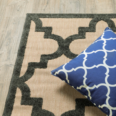 Oriental Weavers Cayman 660N9 textured indoor-outdoor rug featuring abstract pattern in sand/ charcoal tones