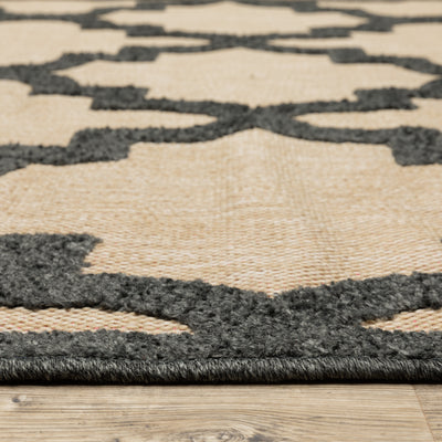 Oriental Weavers Cayman 660N9 textured indoor-outdoor rug featuring abstract pattern in sand/ charcoal tones