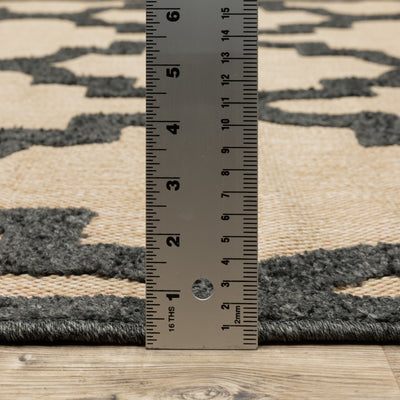 Oriental Weavers Cayman 660N9 textured indoor-outdoor rug featuring abstract pattern in sand/ charcoal tones