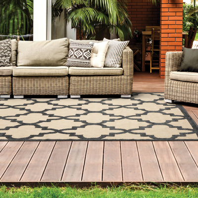 Oriental Weavers Cayman 660N9 textured indoor-outdoor rug featuring abstract pattern in sand/ charcoal tones