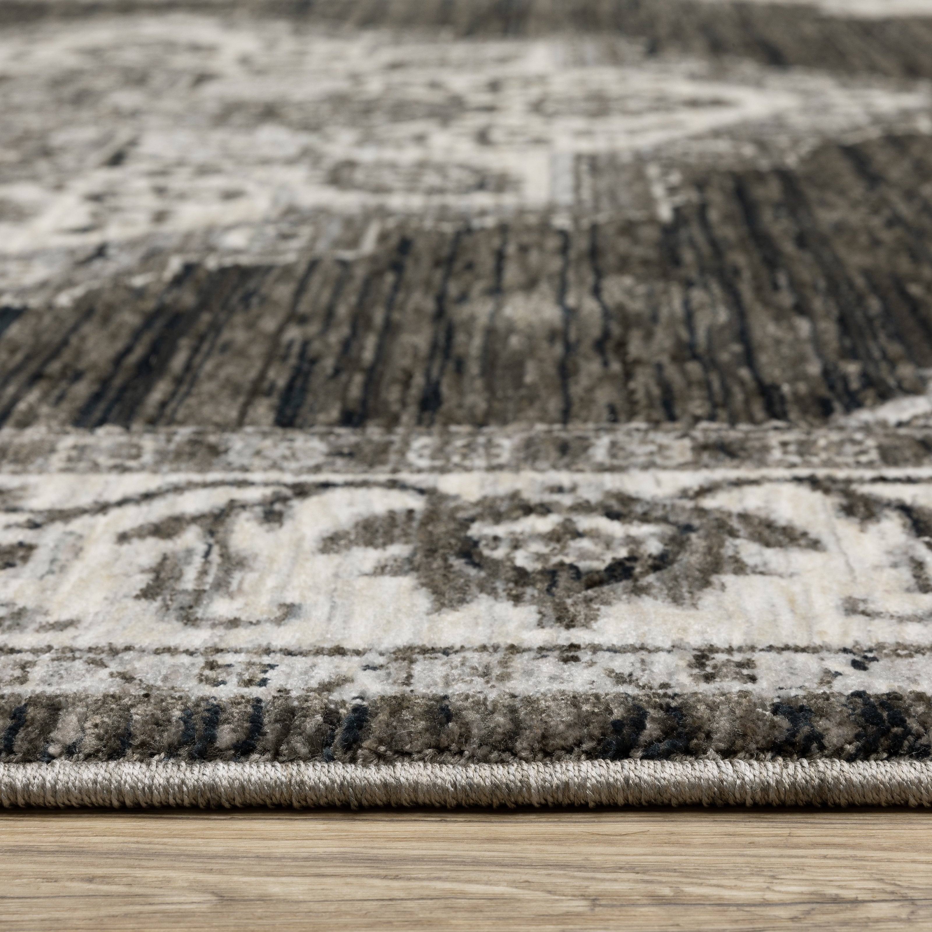 Oriental Weavers Chamberlain CH05C plush traditional rug featuring decorative pattern in charcoal/ ivory tones