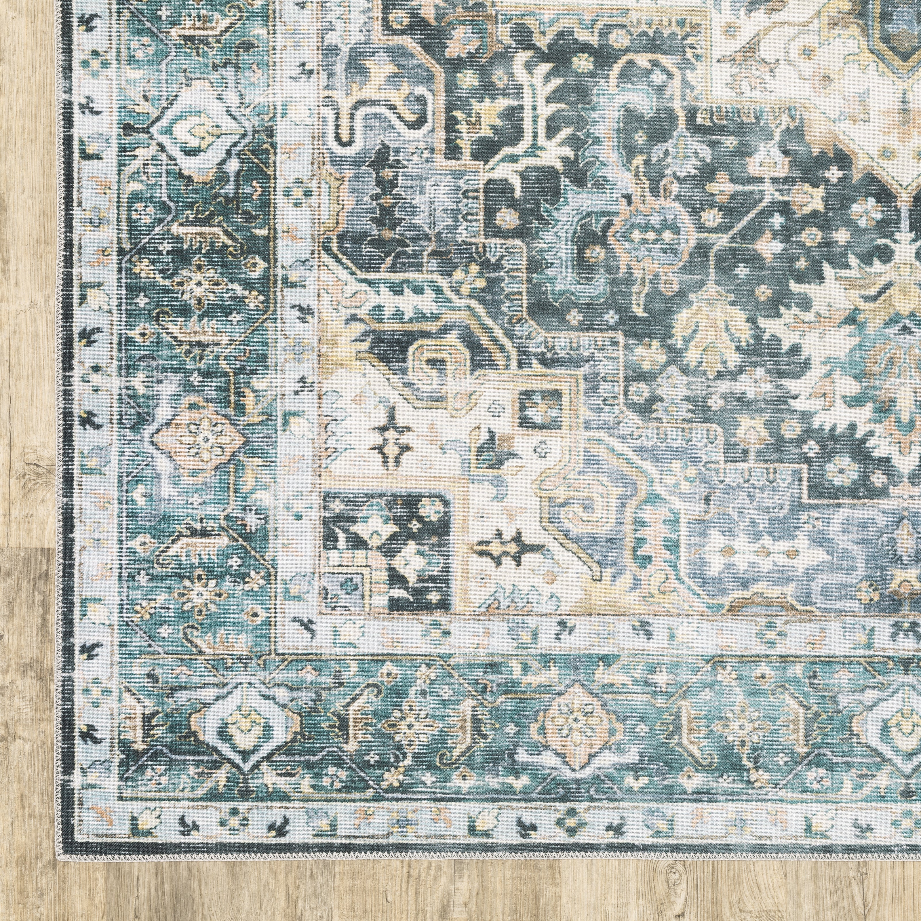 Oriental Weavers Charleston CHA01 traditional rug featuring decorative pattern in blue/ ivory tones