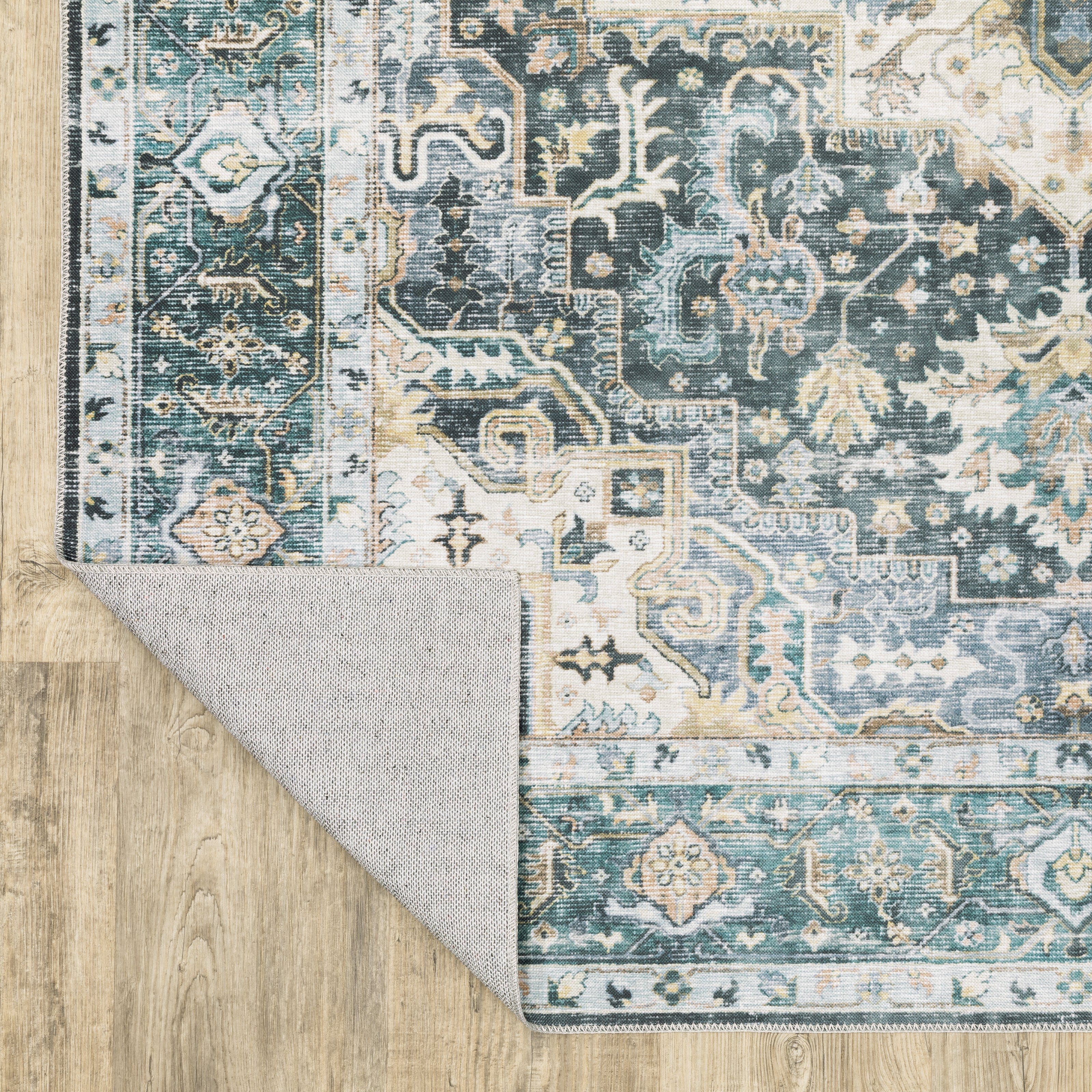 Oriental Weavers Charleston CHA01 traditional rug featuring decorative pattern in blue/ ivory tones