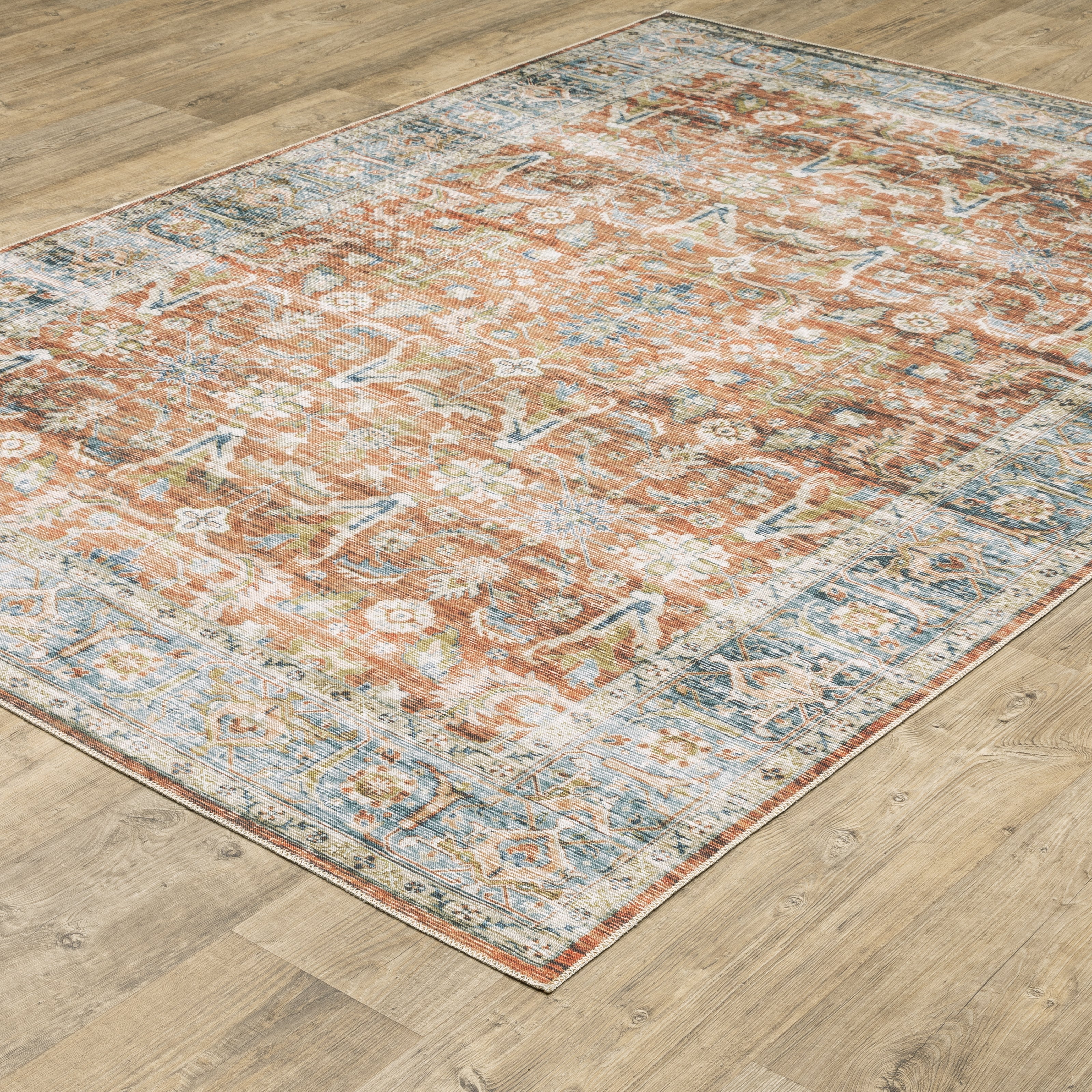 Oriental Weavers Charleston CHA04 traditional rug featuring decorative pattern in rust/ blue tones
