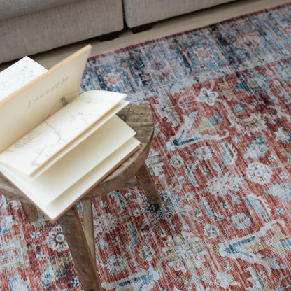 Oriental Weavers Charleston CHA04 traditional rug featuring decorative pattern in rust/ blue tones