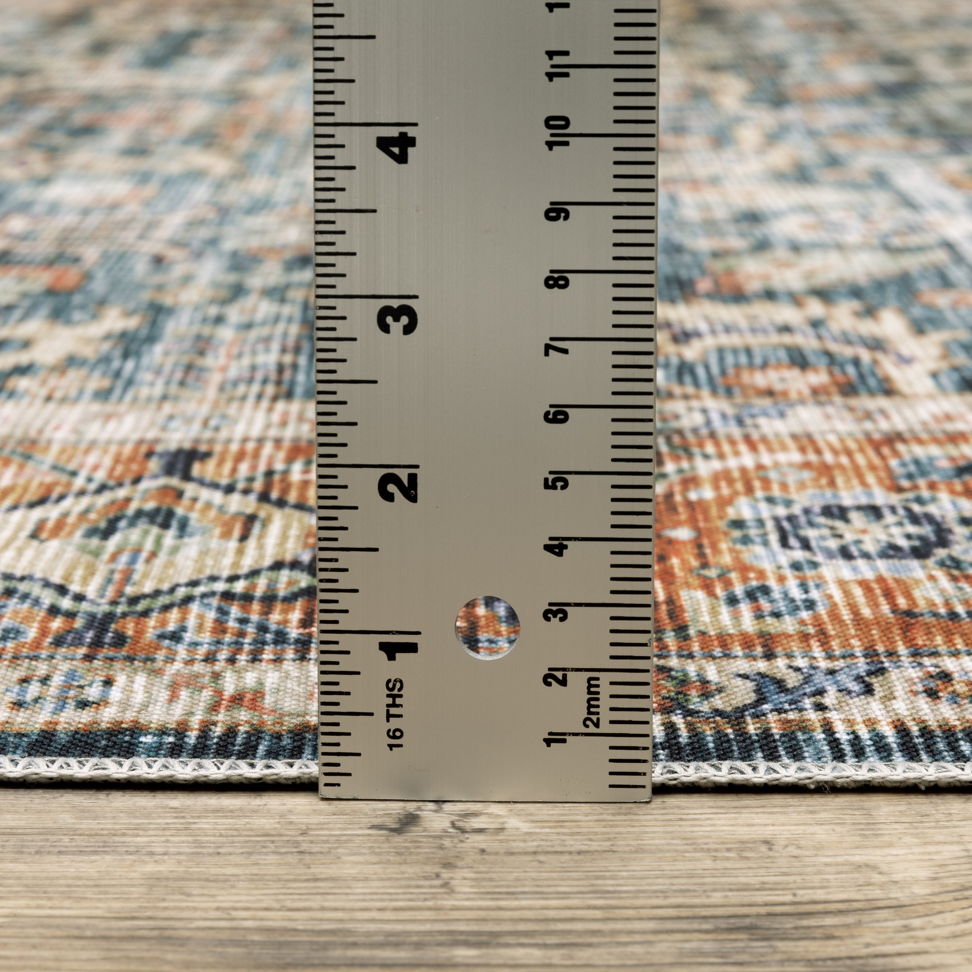 Oriental Weavers Charleston CHA06 traditional rug featuring decorative pattern in blue/ rust tones