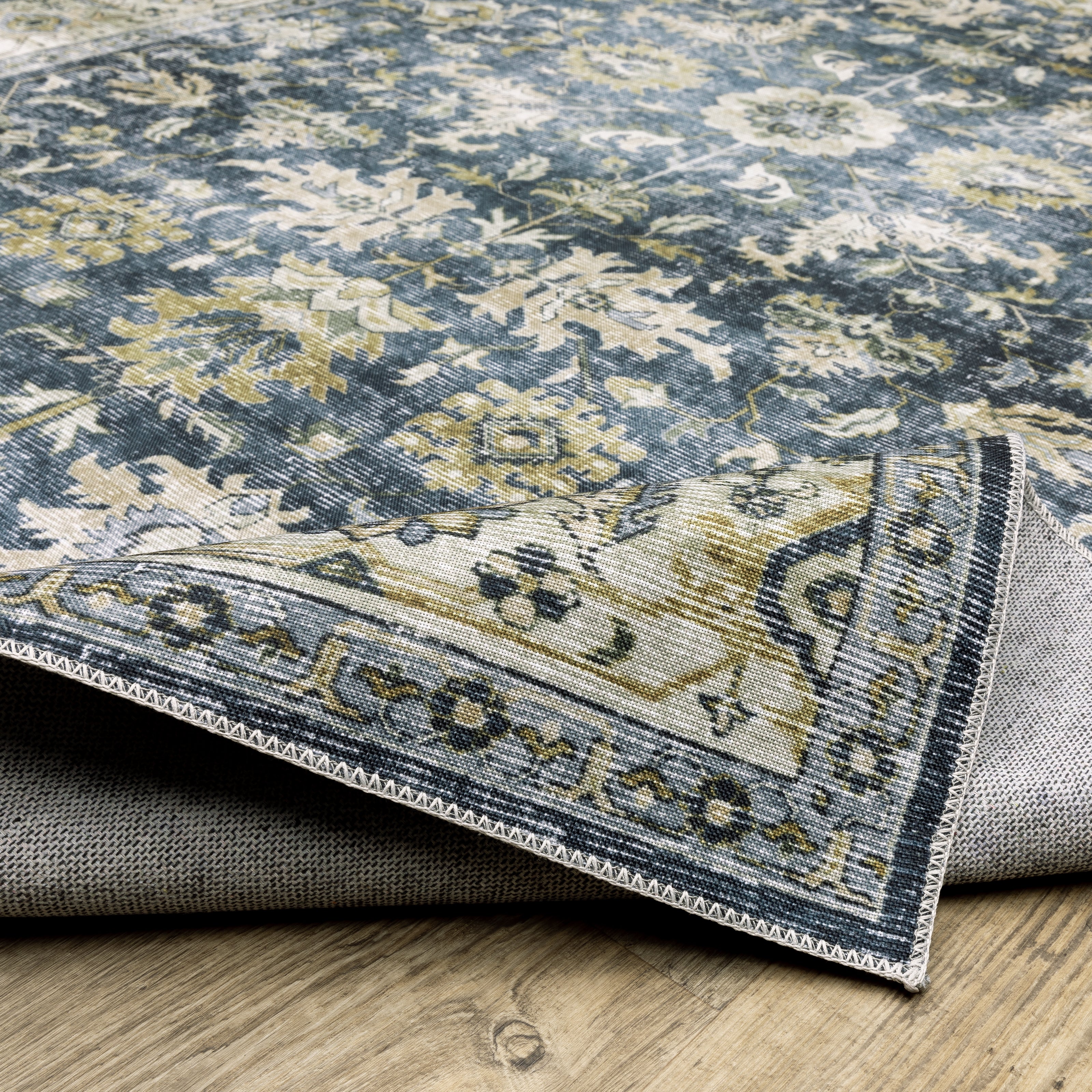 Oriental Weavers Charleston CHA08 traditional rug featuring decorative pattern in blue/ gold tones