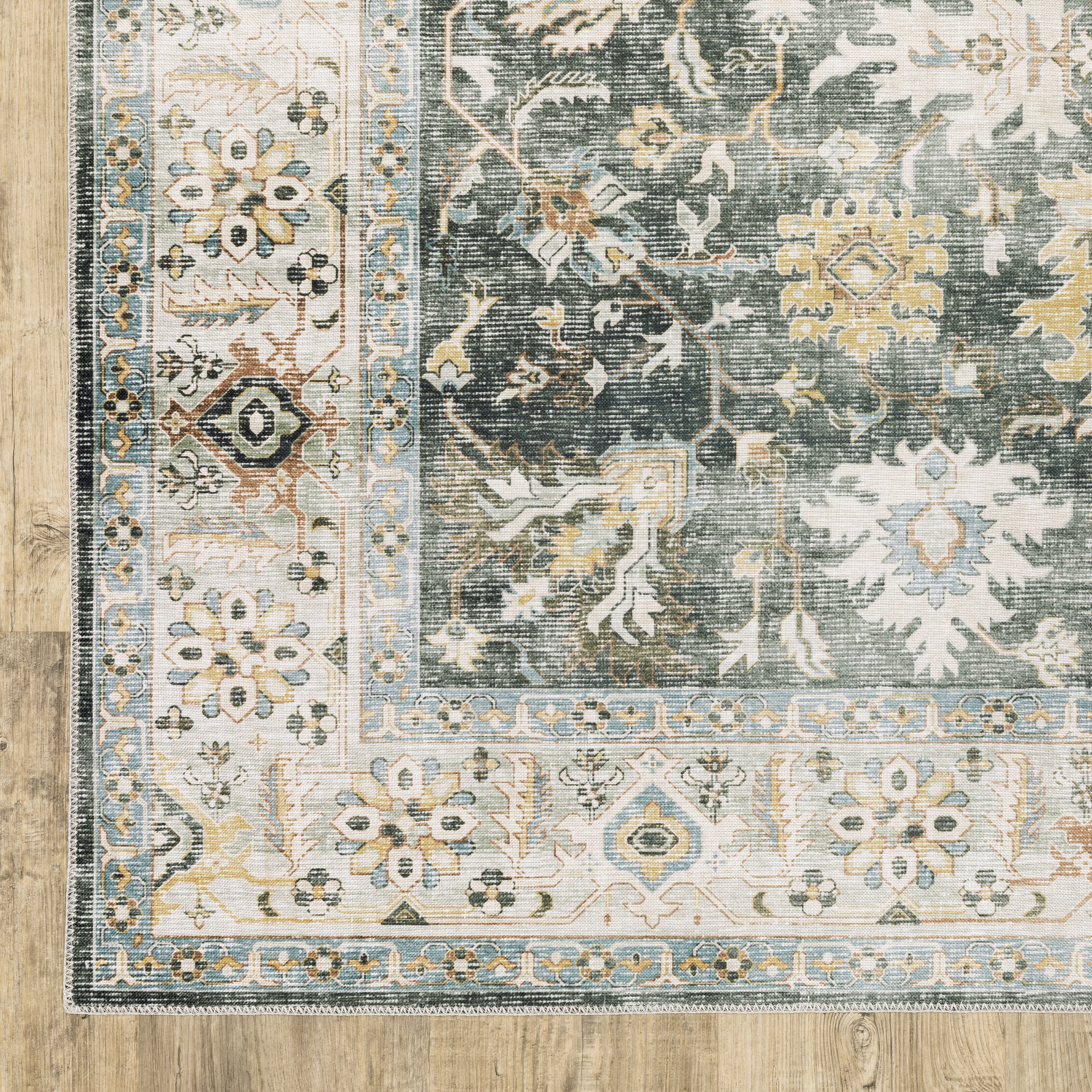 Oriental Weavers Charleston CHA09 traditional rug featuring decorative pattern in charcoal/ gold tones