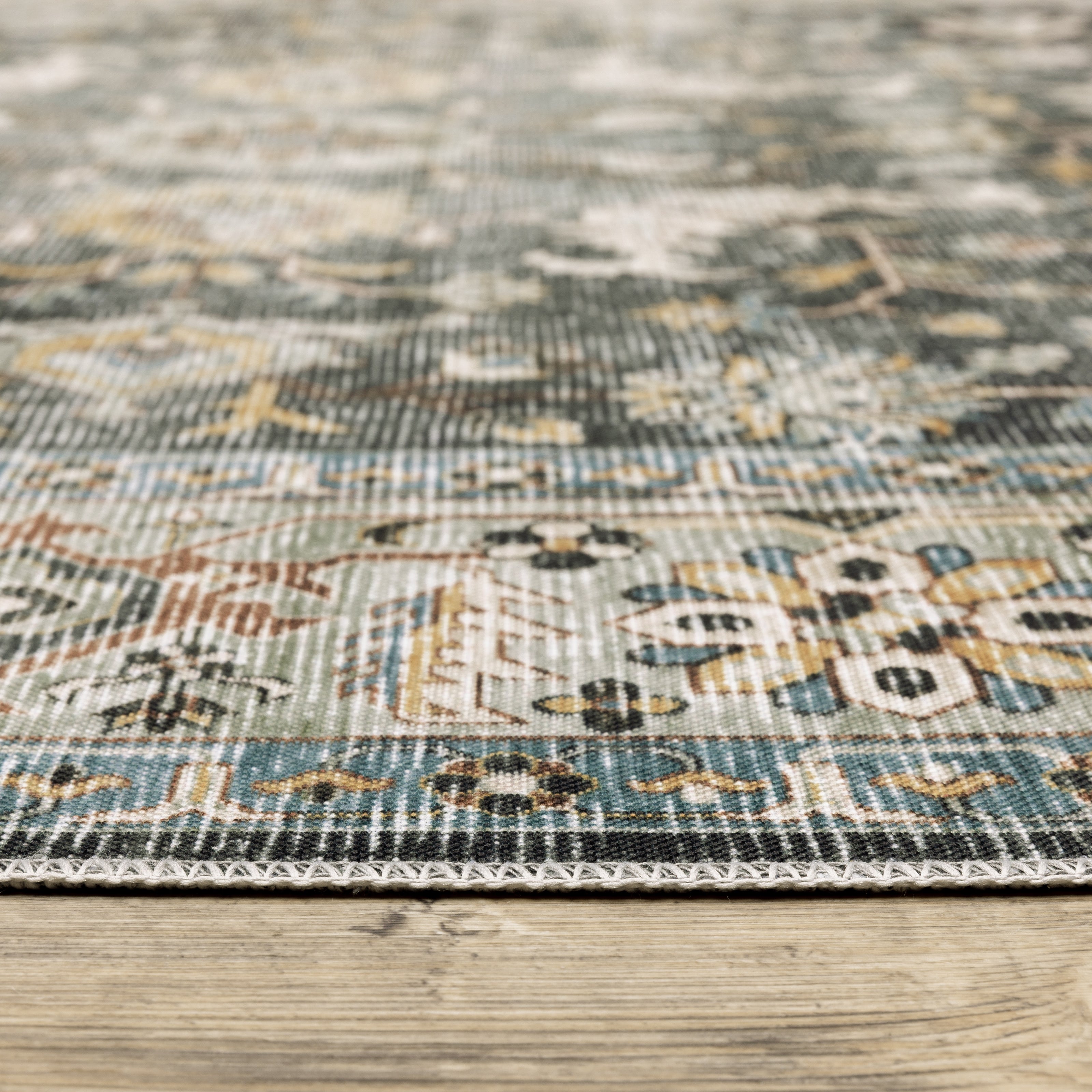 Oriental Weavers Charleston CHA09 traditional rug featuring decorative pattern in charcoal/ gold tones