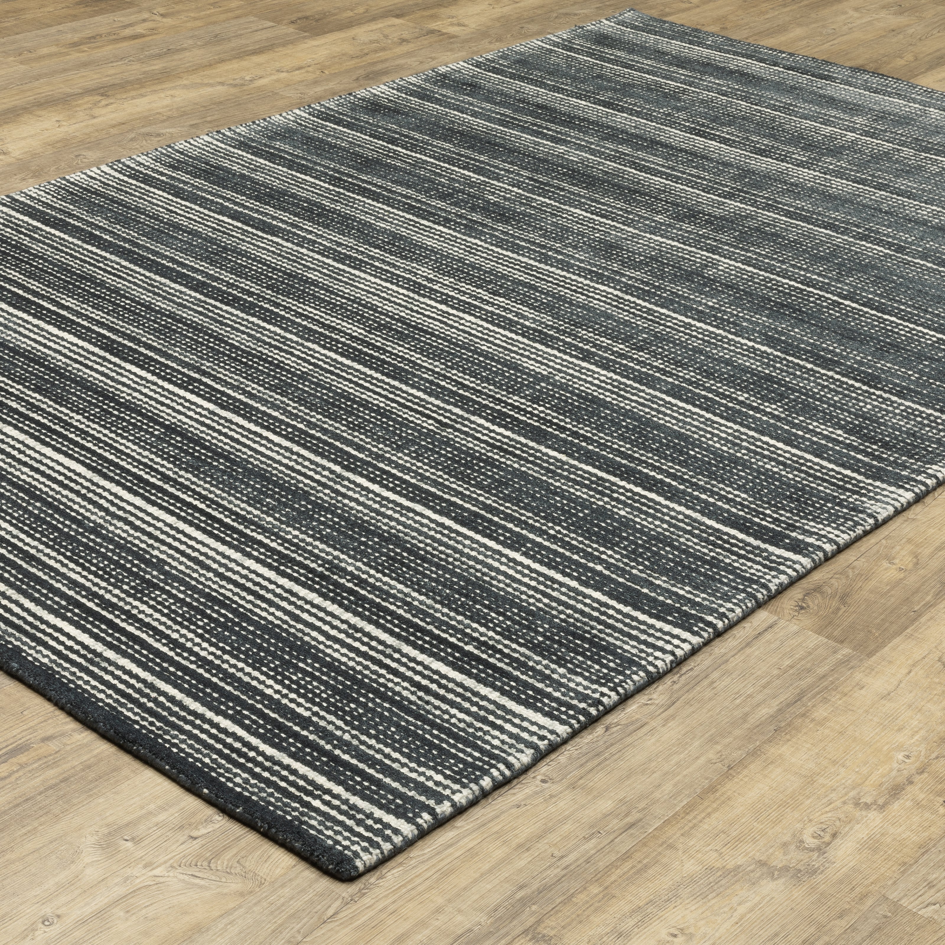 Oriental Weavers Circa CIR02 soft area rug featuring textured design in black/ ivory tones
