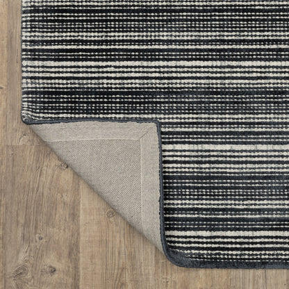 Oriental Weavers Circa CIR02 soft area rug featuring textured design in black/ ivory tones