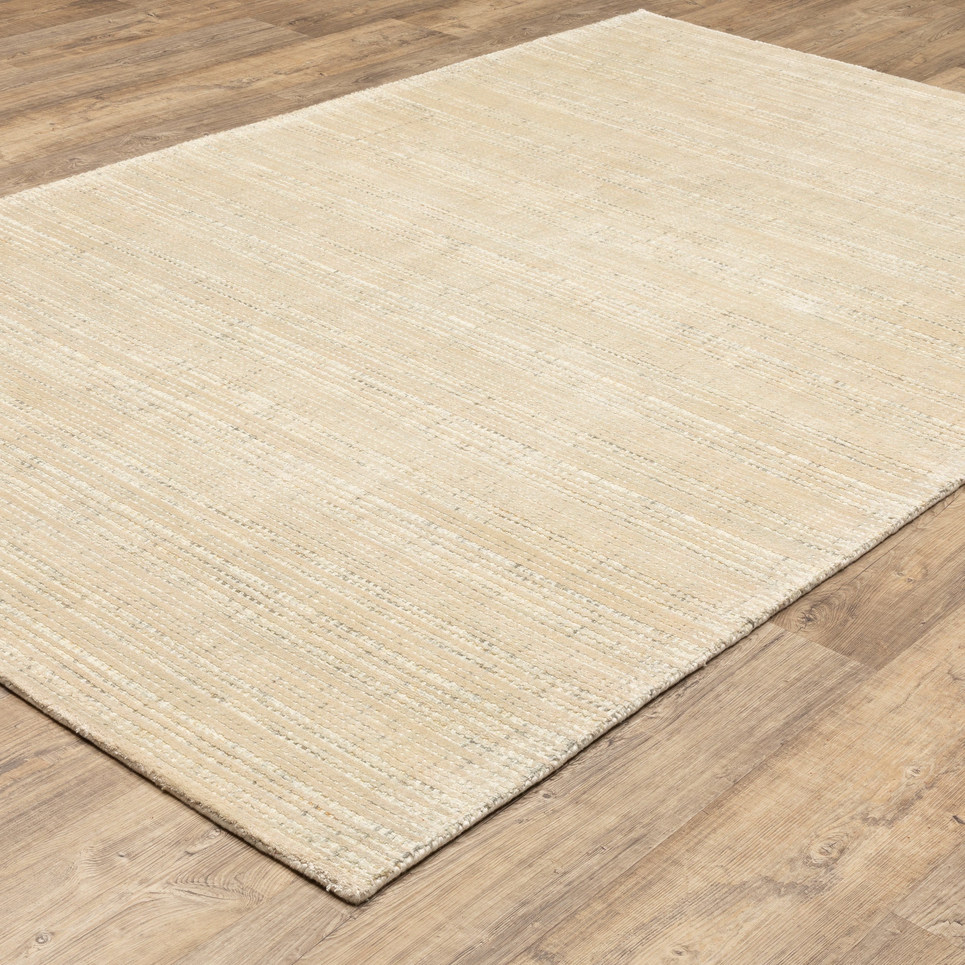 Oriental Weavers Circa CIR03 soft area rug featuring textured design in beige/ ivory tones