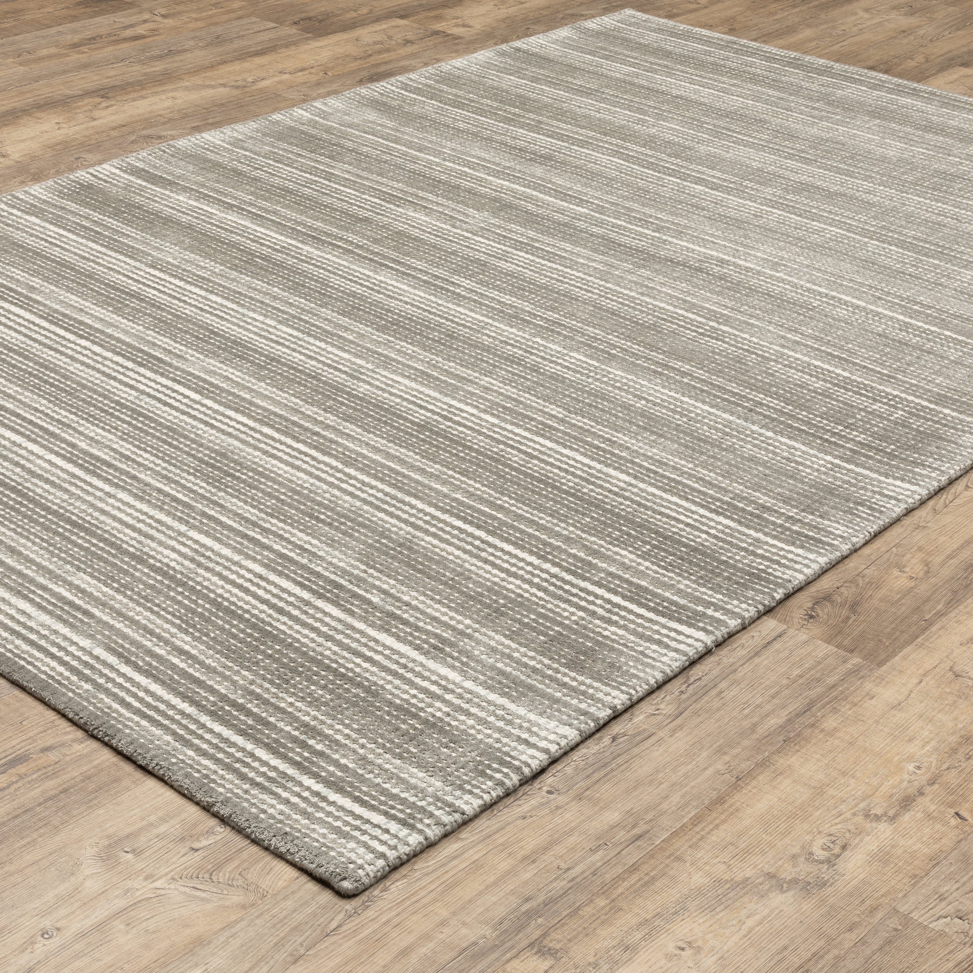 Oriental Weavers Circa CIR04 soft area rug featuring textured design in grey/ ivory tones
