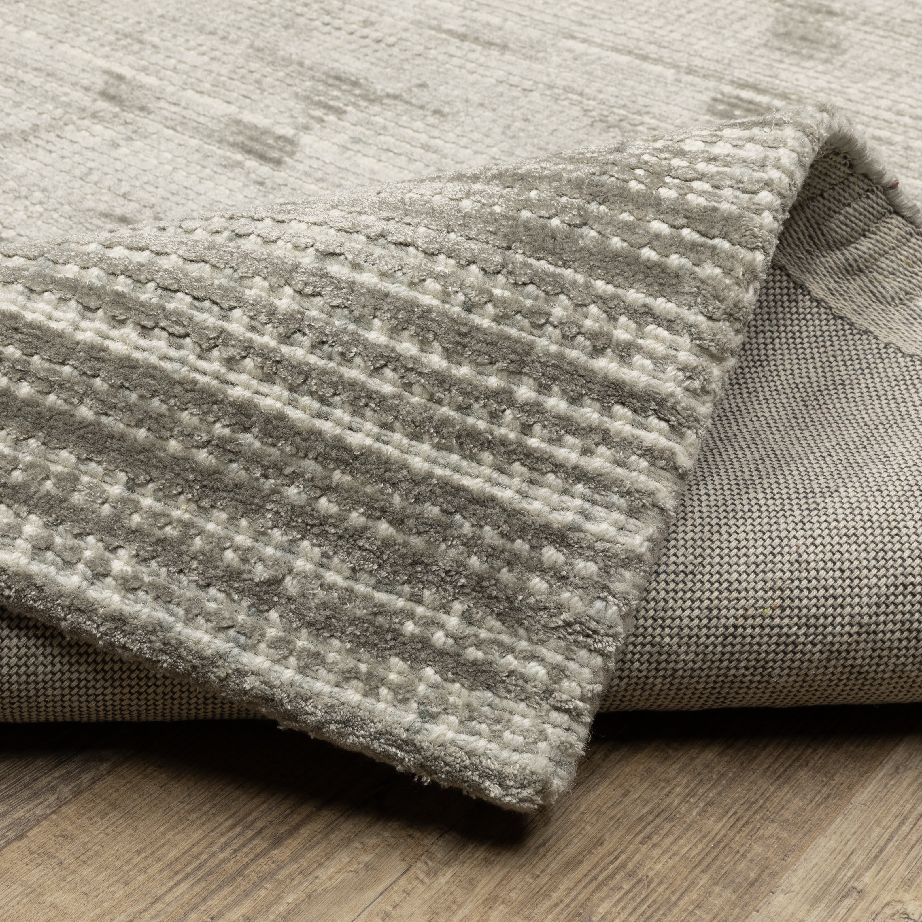 Oriental Weavers Circa CIR04 soft area rug featuring textured design in grey/ ivory tones