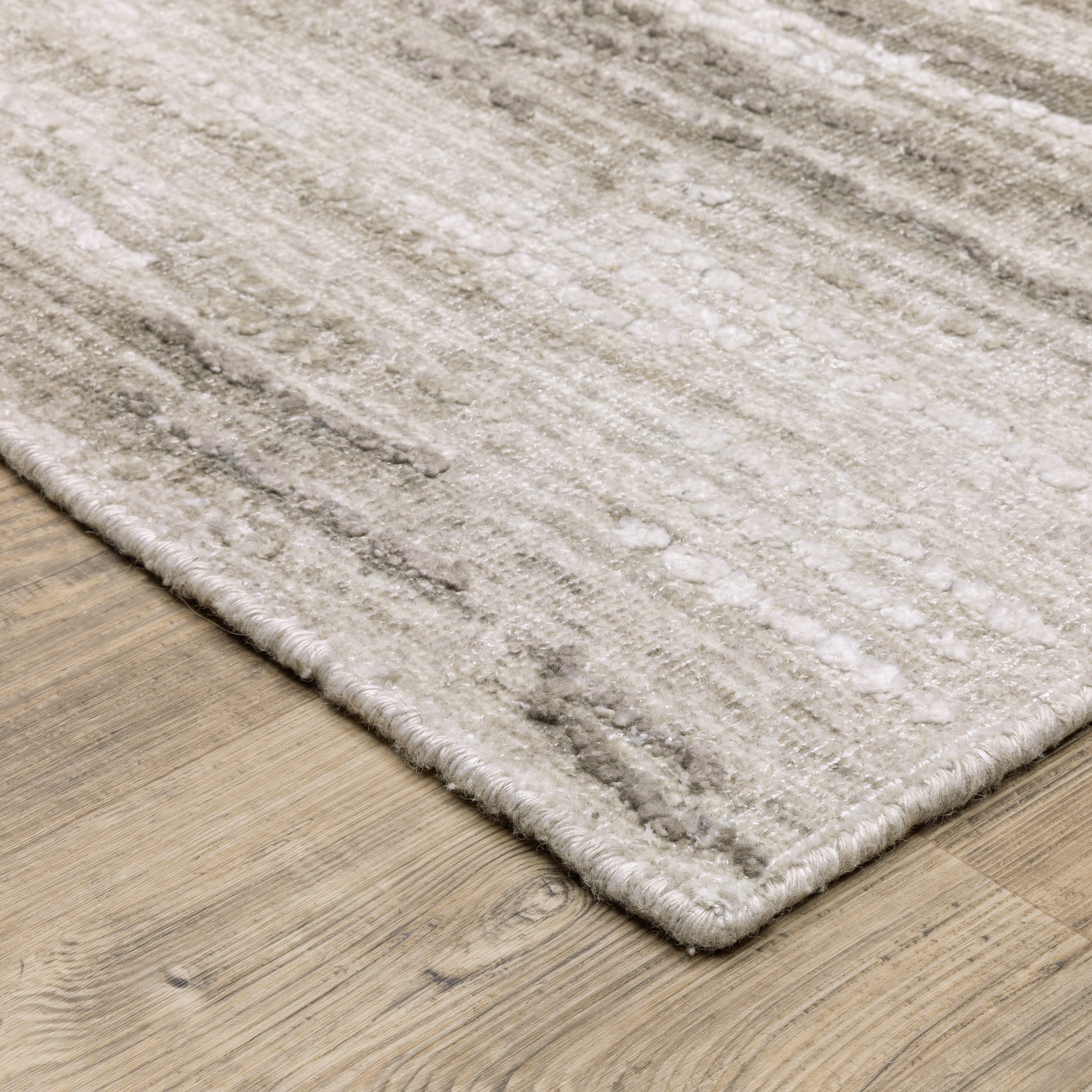 Oriental Weavers Clarke CLA01 soft modern rug featuring abstract pattern in beige/ brown tones