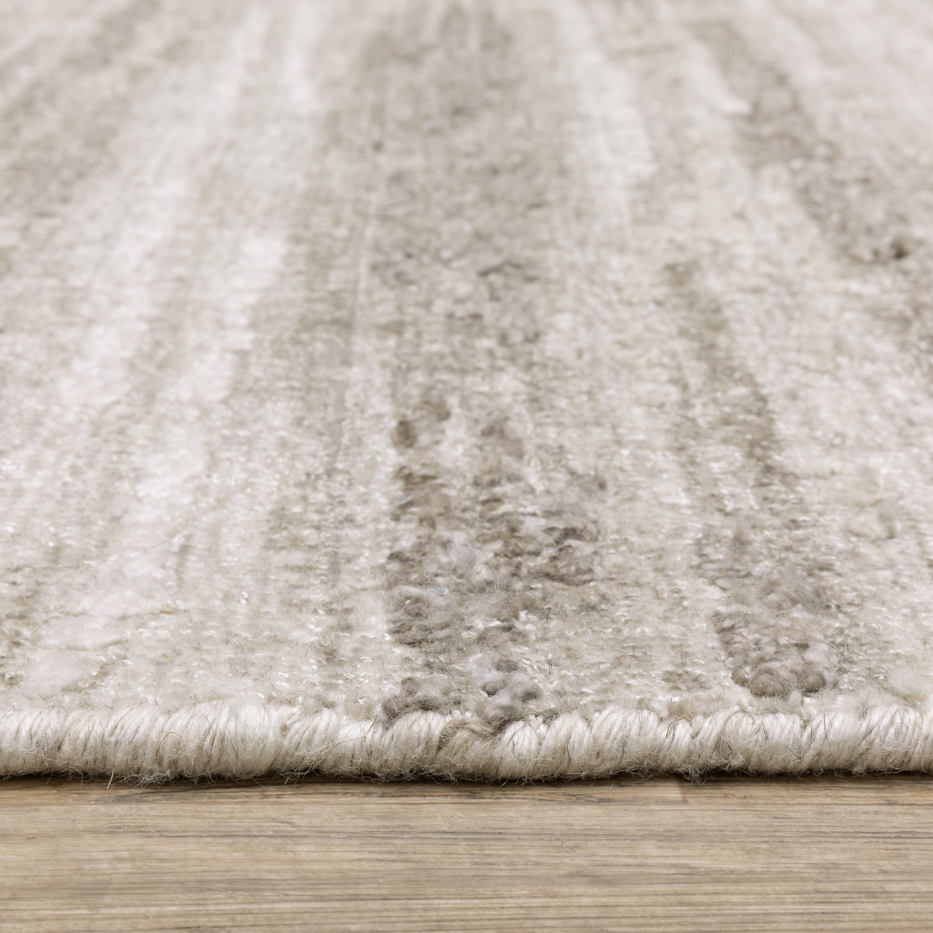 Oriental Weavers Clarke CLA01 soft modern rug featuring abstract pattern in beige/ brown tones