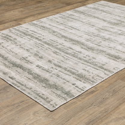 Oriental Weavers Clarke CLA02 soft modern rug featuring abstract pattern in beige/ green tones